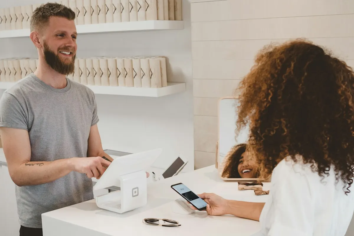 Customer paying at a shop counter