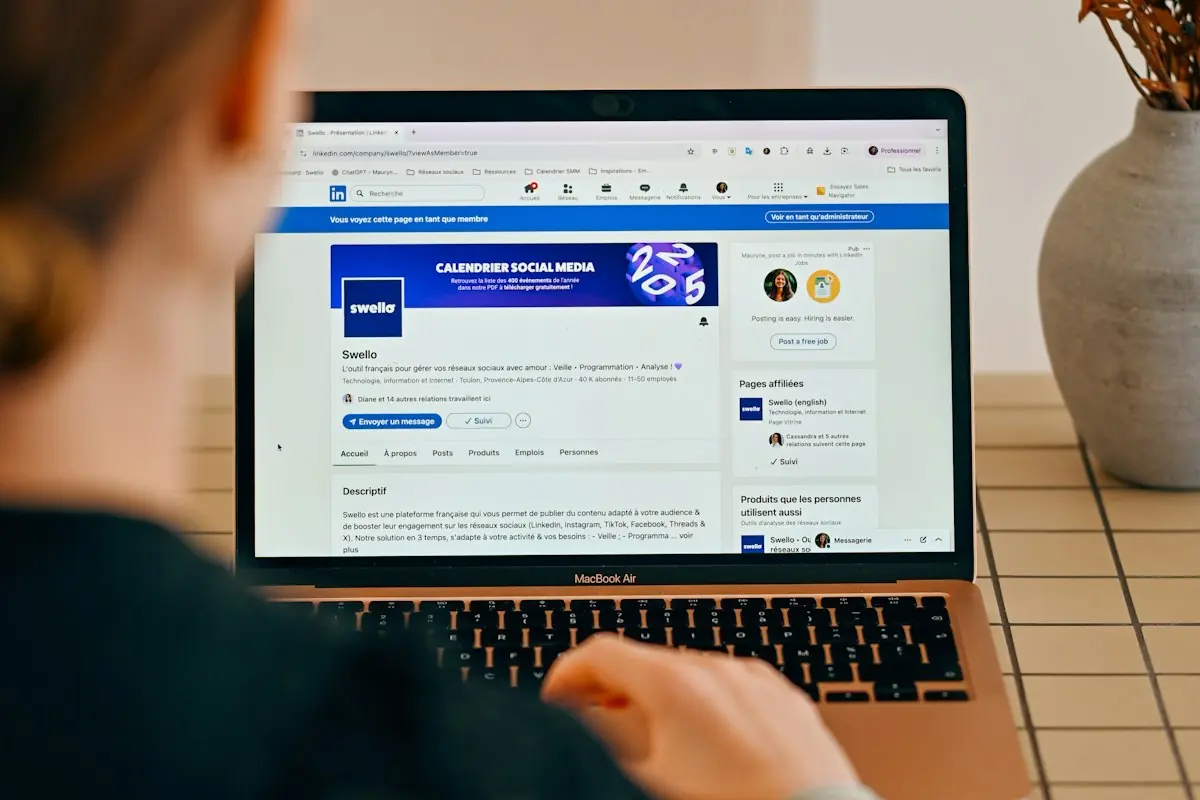 Woman managing social media on a laptop
