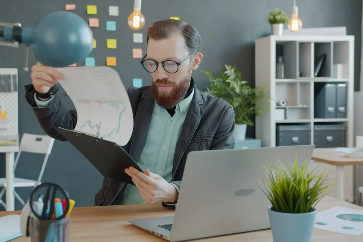 Office worker reviewing charts and documents