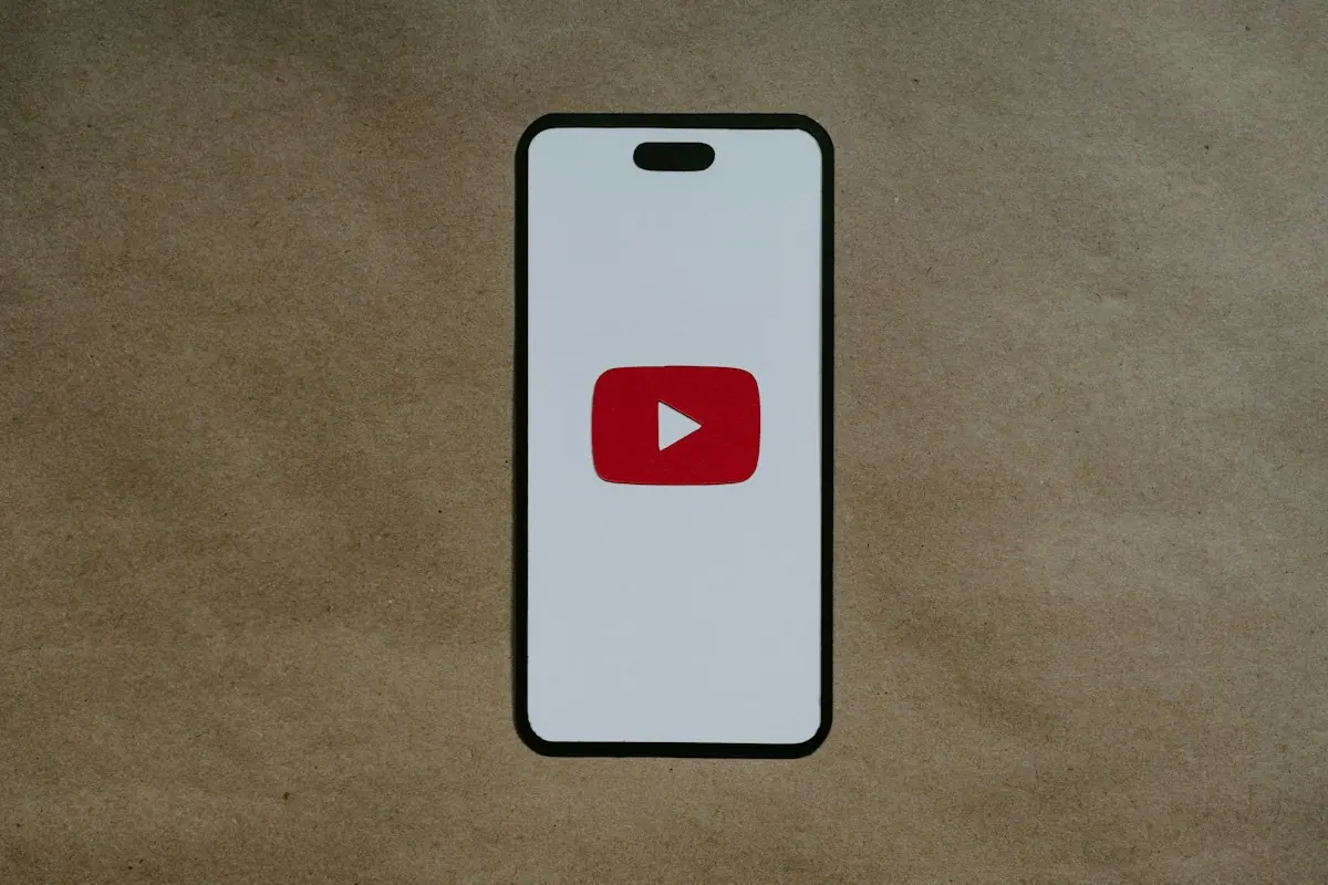 White smartphone with a YouTube logo